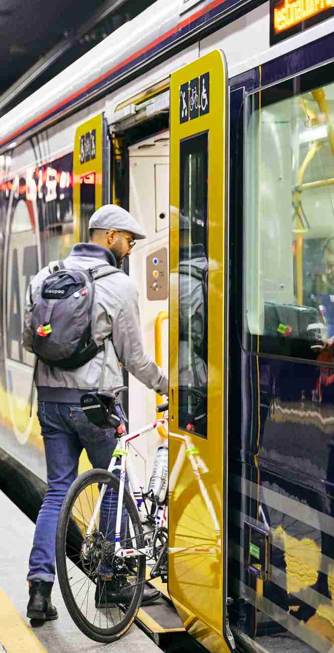 Bike users boarding train crop2