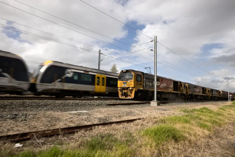 AT train next to KiwiRail train