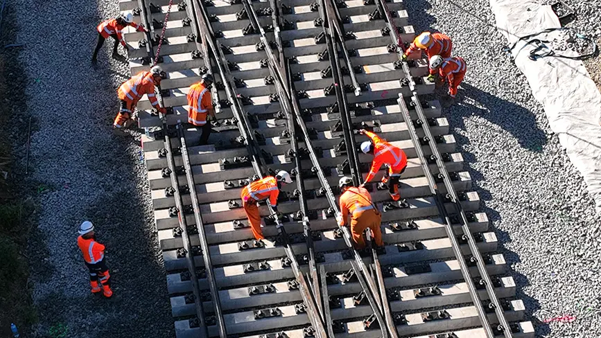 Workers in high-vis maintaining track
