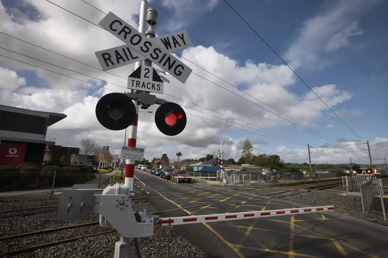 Level crossing sign at road