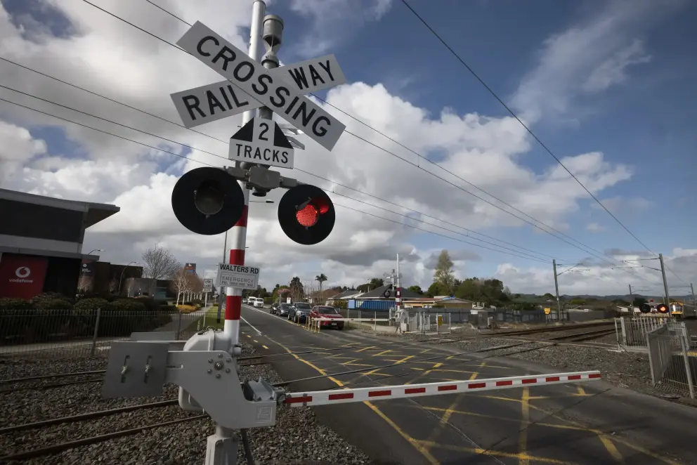 Level crossing sign at road